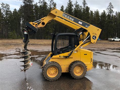 john deere 317 skid steer oil drain plug location|john deere 317 manual.